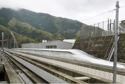 In this April 21, 2015, file photo, a Japanese maglev train that is the fastest passenger train in the world runs on the Maglev Test Line in Tsuru, west of Tokyo. Prosecutors raided the headquarters of several of Japan’s biggest construction companies in an investigation into alleged collusion on bids for a multibillion dollar high-speed maglev train line. News reports Tuesday, Dec. 19, 2017 showed investigators heading into the headquarters of Taisei Corp. and Obayashi Corp., two of four companies targeted in the probe.