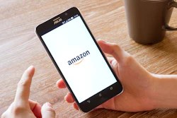 Man Hand Holding Screen Shot Of Amazon Application 588359470 2125x1416