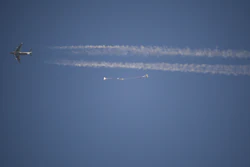 In this photo released by NASA, a replica Orion Spacecraft is dropped from a U.S. Air Force C-17 transport aircraft at 35,000 feet in altitude to a southwestern Arizona desert site to test the craft's ability to cope with a partial parachute failure at the U.S. Army Proving Ground in Yuma, Ariz., Friday, Dec. 15, 2017. The test used two of Orion's three main parachutes to simulate the failure of the third and still sufficiently slowed the spacecraft for a landing. It was the fifth of eight tests to qualify Orion's parachute system for flights with astronauts beginning with Exploration Mission-2.