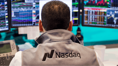 In this April 16, 2015, file photo, an employee monitors prices at the tech-driven Nasdaq MarketSite in New York. From Silicon Valley to Shanghai, surging share prices for technology companies means the industry is making up an ever-larger chunk of stock funds. Tech companies have been able to produce strong profit growth for years, even when the global economy was scuffling, but the strong performance also raises worries that they’re overpriced.