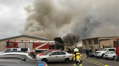 Photo provided by Red Cross section Gaenserndorf shows a firefighter in the gas station in Baumgarten an der March, Austria, near the Slovakian border, Tuesday, Dec. 12, 2017 after an explosion occurred.