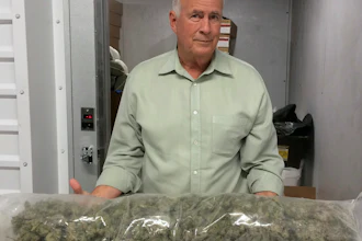 In this photo taken Nov. 28, 2017, Brad Eckenweiler, chief executive of Lifestyle Delivery Systems, poses for a photo while holding cannabis buds from his freezer that will be used to manufacture concentrates in Adelanto, Calif. Lifestyle is what’s known as a “vertically integrated company,” with a hand in every aspect of the business, from producing organic seeds to transportation and over-the-counter sales.
