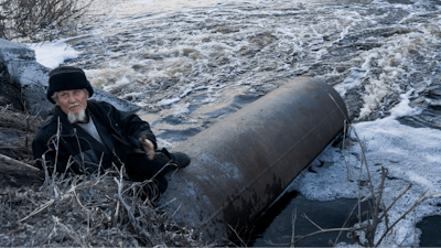 In this file photo taken on Thursday, April 7, 2016, an old man fishes in a lake that connects to the nearby Techa River, near the village of Muslyumovo, Chelyabinsk region, Russia, which is polluted with radioactive waste from the Mayak nuclear plant. Mayak is a nuclear complex that has been responsible for at least two of the country's biggest radioactive accidents. Russian authorities denied Friday that a radioactivity spike in the air over Europe resulted from a nuclear fuel plant leak in the Urals, saying their probe has found no release of radioactivity there.