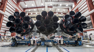 This photo made available by SpaceX on Wednesday, Dec. 20, 2017 shows the new Falcon Heavy rocket in a hangar at Cape Canaveral, Fla. It is scheduled for a test flight in January 2018.