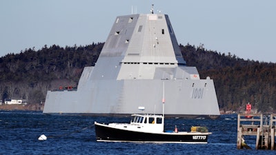 The future USS Michael Monsoor passes Fort Popham travels down the Kennebec River as it heads out to sea for trials, Monday, Dec. 4, 2017, in Phippsburg, Maine. The ship is the second in the stealthy Zumwalt class of destroyers.