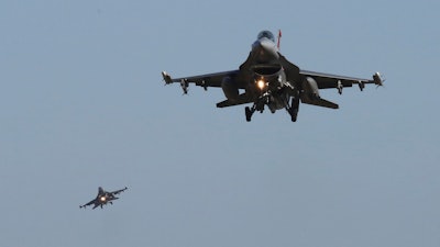 U.S. Air Force F-16 fighter jets fly over the Osan U.S. Air Base in Pyeongtaek, South Korea, Monday, Dec. 4, 2017. Hundreds of aircrafts including two dozen stealth jets began training Monday as the United States and South Korea launched their combined air force exercise.