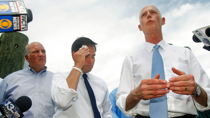In this Aug. 13, 2013, file photo, Rep. Steve Southerland, R-Fla. and Sen. Marco Rubio listen to Florida Gov. Rick Scott announce a lawsuit against the state of Georgia, while touring Apalachicola, Fla. Florida is hoping the Supreme Court will come to the rescue of this slice of northwestern Florida, which the state says has been devastated by greedy water users in Georgia. The high court hears argument Monday, Jan. 8, 2018, in the long-running water war between the neighboring states.