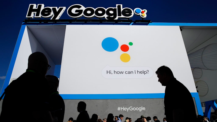 People wait in line to enter the Google booth at CES International, Wednesday, Jan. 10, 2018, in Las Vegas.