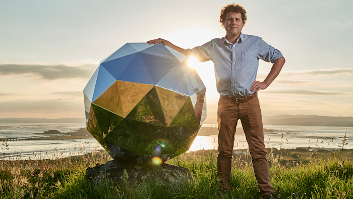In this Nov. 2017 photo provided by Rocket Lab, Rocket Lab founder and CEO Peter Beck is pictured with his 'Humanity Star' in Auckland, New Zealand. Beck, the founder of the company that this week launched the first rocket into orbit from New Zealand said on Wednesday, Jan 24, 2018, that he had deployed a secret satellite he believes will be the brightest object in the night sky and which he hopes will remind people of their precarious place in a vast universe.