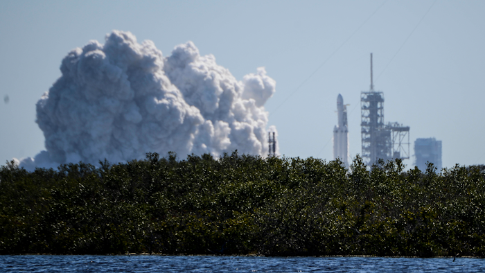 SpaceX fired up its newest, biggest rocket in a critical launch pad test Wednesday, Jan. 24, 2018, advancing toward a long-anticipated test flight possibly in just a week. The Falcon Heavy briefly roared to life for the first time at NASA's Kennedy Space Center. All three boosters — 27 engines in all — were tested.