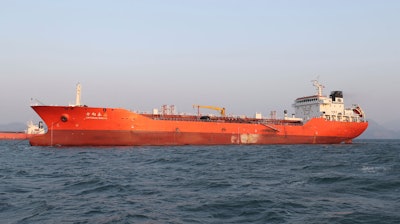 In this Friday, Dec. 29, 2017, file photo, the Lighthouse Winmore, a Hong Kong-flagged ship, is seen in waters off Yeosu, South Korea. Prosecutors in Taiwan say they are investigating a man suspected of involvement in illegal oil sales after reports last week that South Korean authorities seized the Hong Kong-flagged, Lighthouse Winmore ship for violating U.N. sanctions by selling oil to North Korea and that a Taiwan company was involved.