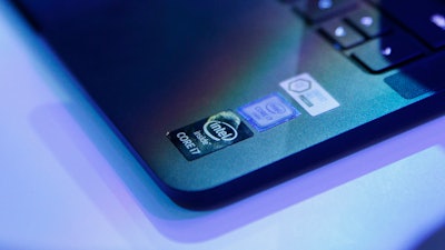 This Thursday, Jan. 7, 2016, file photo shows a laptop that uses Intel's chip technology, at the Intel booth during CES International in Las Vegas. Technology companies are scrambling to fix serious security flaws affecting computer processors built by Intel and other chipmakers and found in many of the world's personal computers and smartphones.