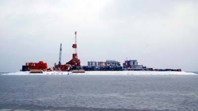In this Oct. 17, 2017 file photo provided by the Bureau of Safety and Environmental Enforcement, oil production equipment appears on Spy Island, an artificial island in state waters of Alaska's Beaufort Sea. The Trump administration on Thursday, Jan. 4, 2018 moved to vastly expand offshore drilling from the Atlantic to the Arctic oceans with a plan that would open up federal waters off the Pacific coast for the first time in more than three decades. Alaska's Beaufort Sea is one of those areas.