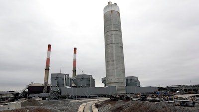 This Jan. 25, 2017 file photo shows Gallatin Fossil Plant in Gallatin, Tenn. State environmental regulators say it shouldn’t cost ratepayers more money or take as long as the nation’s largest public utility has estimated to complete a massive, court-ordered coal ash cleanup at the Tennessee power plant. State officials voiced skepticism over the Tennessee Valley Authority’s 24-year timeline and cost claims in federal court filings and state records. The utility has said it’s taking steps to comply with the court’s cleanup requirement, even as it appeals the order.