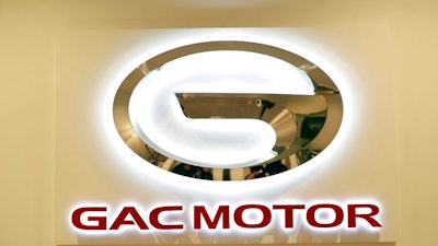 The logo of the Guangzhou Automobile Group is seen at the North American International Auto Show, Monday, Jan. 15, 2018, in Detroit. Chinese automaker GAC Motor says it's on track to enter the U.S. market in the fourth quarter of 2019.