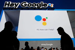 People wait in line to enter the Google booth at CES International, Wednesday, Jan. 10, 2018, in Las Vegas.