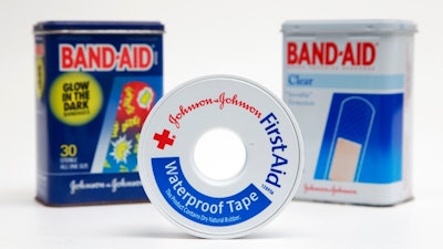 This Tuesday, Sept. 13, 2016, file photo, shows a selection of Johnson & Johnson brand first aid products arranged for a photo, in Surfside, Fla. Johnson & Johnson reports financial earnings Tuesday, Jan. 23, 2018.