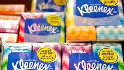 This Jan. 20, 2011, file photo shows packages of Kleenex tissues, a Kimberly Clark brand, at a store in San Francisco. Kimberly-Clark is cutting 5,000 to 5,500 jobs, or 12 percent to 13 percent of its workforce, as the consumer products company tries to lower costs.