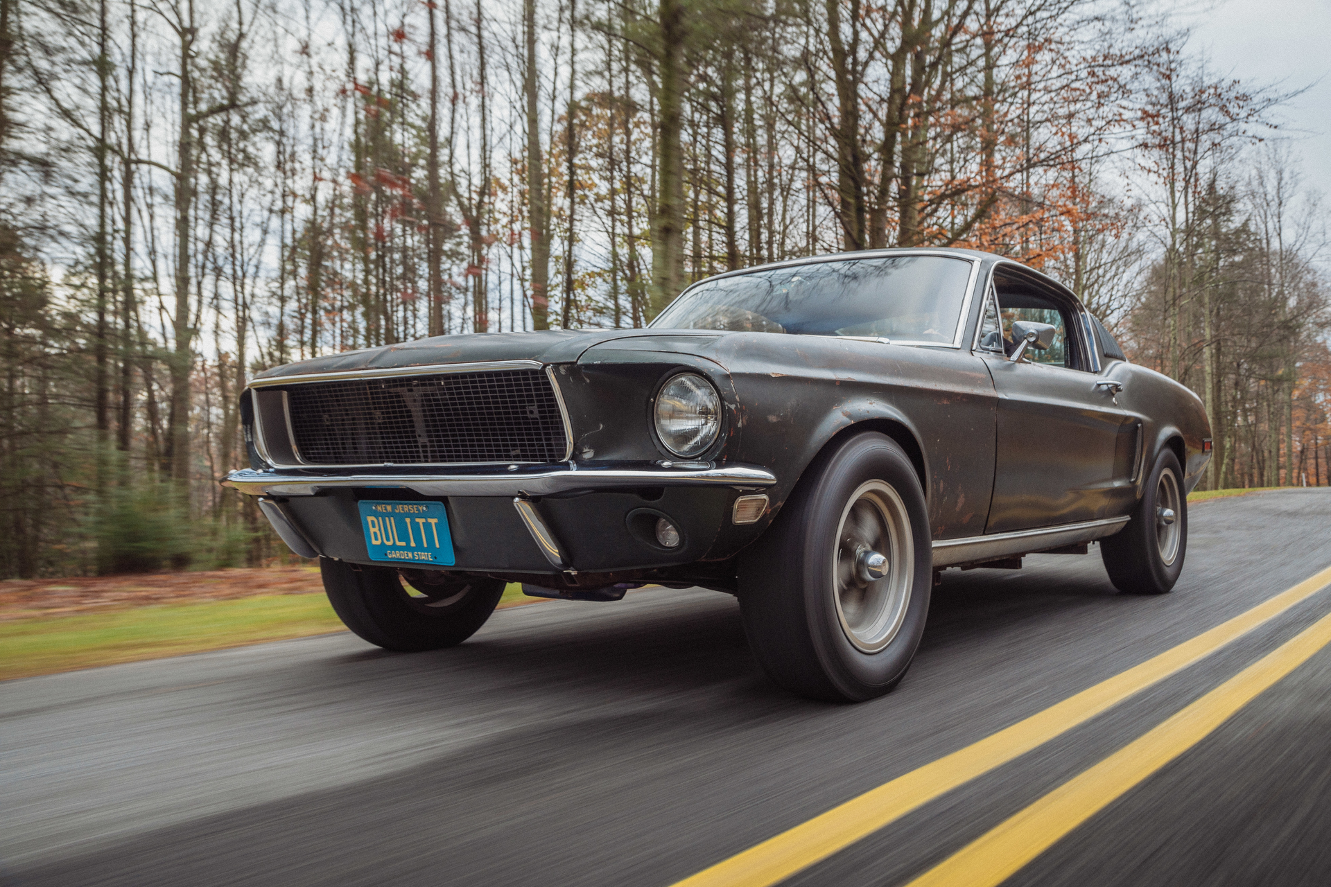 Sean Kiernan driving his original 1968 Mustang that starred in movie Bullitt.