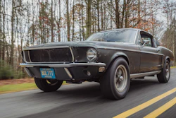 Sean Kiernan driving his original 1968 Mustang that starred in movie Bullitt.