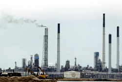 In this Sept. 30, 2011, file photo, part of the Royal Dutch Shell refinery is seen on Pulau Bukom, five kilometers (3 miles) off Singapore. Singapore police said Tuesday, Jan. 9, 2018, they have arrested 17 men suspected of involvement in stealing oil from Shell's largest refinery in the world. Police also seized $2.3 million and an oil tanker in connection with the case.