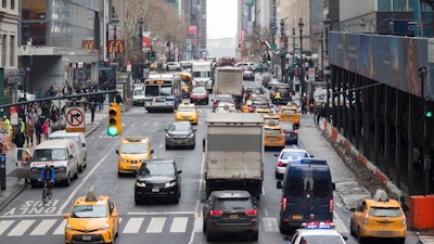 In this Jan. 11, 2018 file photo, traffic makes it's way across 42nd Street in New York City. Motorists would have to shell out $11.52 to drive into the busiest parts of Manhattan under a new proposal commissioned by Democratic Gov. Andrew Cuomo to ease traffic congestion and raise vital funds for mass transit. Trucks would pay even more — $25.34 — while taxi cabs, Uber rides and for-hire vehicles would be charged between $2 and $5 per ride.