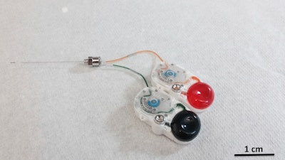 This undated image provided by researcher Canan Dagdeviren in January 2018 shows an implant that can precisely drip medications deep into the brain by remote control. The device could mark a new approach to treating brain diseases _ potentially reducing side effects by targeting only the hard-to-reach specific sections that need care.