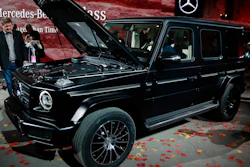 Members of the media look over the Mercedes-Benz G-Class during the North American International Auto Show, Sunday, Jan. 14, 2018, in Detroit.