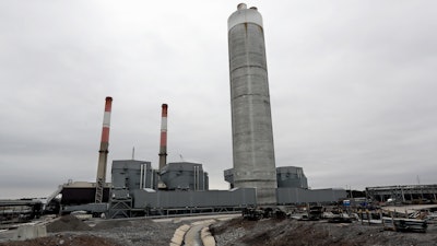 This Jan. 25, 2017 file photo shows Gallatin Fossil Plant in Gallatin, Tenn. State environmental regulators say it shouldn’t cost ratepayers more money or take as long as the nation’s largest public utility has estimated to complete a massive, court-ordered coal ash cleanup at the Tennessee power plant. State officials voiced skepticism over the Tennessee Valley Authority’s 24-year timeline and cost claims in federal court filings and state records. The utility has said it’s taking steps to comply with the court’s cleanup requirement, even as it appeals the order.