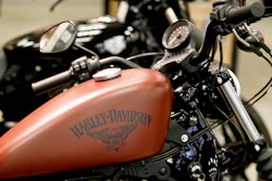 This Wednesday, April 26, 2017, photo shows the Harley-Davidson name on the gas tank of a Harley-Davidson Sportster Iron XL883N at a dealership in Glenshaw, Pa. Harley-Davidson Inc. reports earnings Tuesday, Jan. 30, 2018.