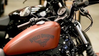 This Wednesday, April 26, 2017, photo shows the Harley-Davidson name on the gas tank of a Harley-Davidson Sportster Iron XL883N at a dealership in Glenshaw, Pa. Harley-Davidson Inc. reports earnings Tuesday, Jan. 30, 2018.