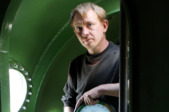 In this April 30, 2008 file photo, submarine owner Peter Madsen stands inside the vessel. A Danish prosecutor said Tuesday Jan. 16, 2018 that inventor Peter Madsen has been charged with murdering Swedish journalist Kim Wall during a trip on his private submarine, saying he either cut her throat or strangled her. Prosecutor Jakob Buch-Jepsen said Tuesday the case is 'very unusual and extremely gross.'