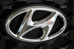 In this Oct. 26, 2017, file photo, the logo of Hyundai Motor Co. is seen on a car displayed at the automaker's showroom in Seoul, South Korea. Hyundai Motor Co. says it will release its first self-driving vehicles to markets by 2021 in partnership with U.S. self-driving technology startup Aurora Innovation Inc.
