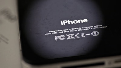 In this Thursday, Dec. 6, 2012, photo, the back of an iPhone 4 in New York. Apple is apologizing for secretly slowing down older iPhones, which it says was necessary to avoid unexpected shutdowns related to battery fatigue. The company issued the statement on its website Thursday, Dec. 28, 2017.