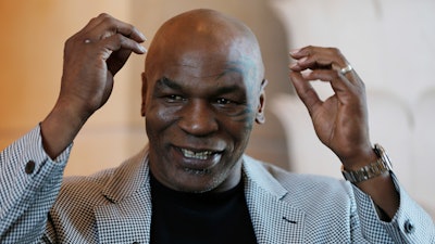 In this May 4, 2017 file photo, Mike Tyson speaks during an interview with The Associated Press, in Dubai, United Arab Emirates. Former heavyweight champion Tyson is becoming a California marijuana entrepreneur. TheBlast.com reports that Tyson and partners on Dec. 20, 2017, broke ground on a plot for a cannabis resort in California City, a remote Mojave Desert town that's about a 110-mile drive north of Los Angeles.