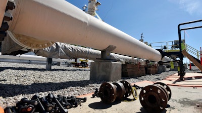 In this June 8, 2017 file photo, fresh nuts, bolts and fittings are ready to be added to the east leg of the pipeline near St. Ignace, Mich., as Enbridge prepares to test the east and west sides of the Line 5 pipeline under the Straits of Mackinac in Mackinaw City, Mich.