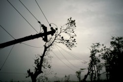 In this Oct. 16, 2017 file photo, power lines lay broken after the passage of Hurricane Maria in Dorado, Puerto Rico. Federal officials said on Monday, Jan. 8 2018, that efforts to fully restore power to Puerto Rico in the wake of Hurricane Maria should get a boost with more work crews and more equipment in upcoming weeks.