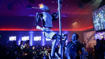 A pole-dancing robot built by British artist Giles Walker performs at a gentlemen's club Monday, Jan. 8, 2018, in Las Vegas. The event was held to coincide with CES International.