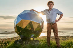In this Nov. 2017 photo provided by Rocket Lab, Rocket Lab founder and CEO Peter Beck is pictured with his 'Humanity Star' in Auckland, New Zealand. Beck, the founder of the company that this week launched the first rocket into orbit from New Zealand said on Wednesday, Jan 24, 2018, that he had deployed a secret satellite he believes will be the brightest object in the night sky and which he hopes will remind people of their precarious place in a vast universe.