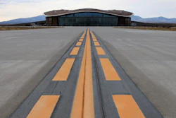 This Dec. 9, 2014, file photo shows the taxiway leading to the hangar at Spaceport America in Upham, N.M. Operators of the New Mexico Spaceport Authority that runs Spaceport America in southern New Mexico are seeking greater confidentiality for tenants that include aspiring commercial spaceflight company Virgin Galactic.