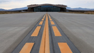 This Dec. 9, 2014, file photo shows the taxiway leading to the hangar at Spaceport America in Upham, N.M. Operators of the New Mexico Spaceport Authority that runs Spaceport America in southern New Mexico are seeking greater confidentiality for tenants that include aspiring commercial spaceflight company Virgin Galactic.