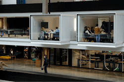 People attend meetings at the world's biggest start-up incubator Station F, in Paris, Wednesday, Jan. 31, 2018. For a glimpse at President Emmanuel Macron's vision for the new French economy, look no farther than Station F. Entrepreneurs don virtual reality goggles and share ideas with business angels in this old Paris train station-turned-startup incubator.