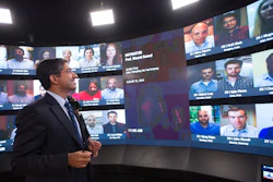 A professor teaches an online class with students from around the world.