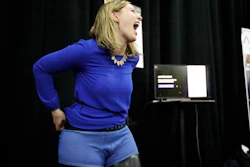 Mariana Marcaletti laughs as she tries on a Spartan boxer, an underwear that blocks radiation from wireless devices, during CES Unveiled at CES International Sunday, Jan. 7, 2018, in Las Vegas.
