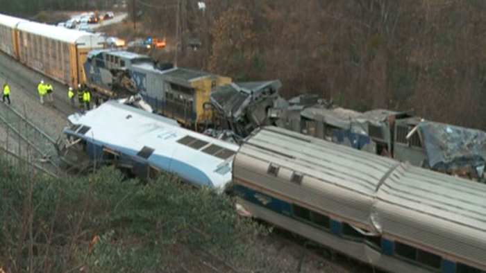 Train cars are smashed and derailed Sunday, Feb. 4, 2018 near Cayce. S.C. The crash left multiple people dead and dozens of people injured.