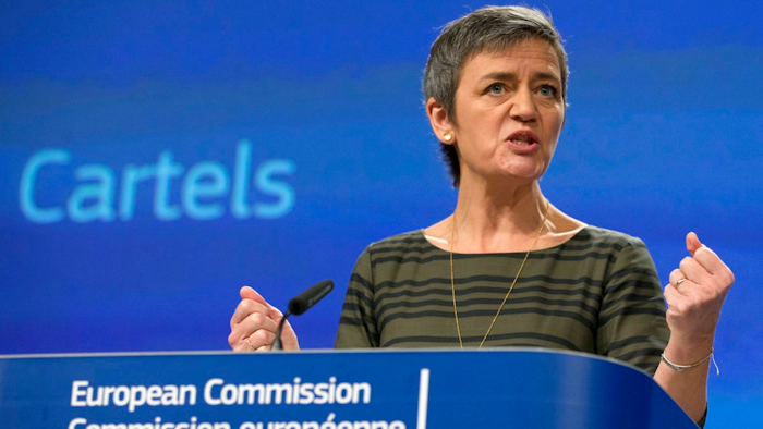 European Commissioner for Competition Margrethe Vestager speaks during a media conference at EU headquarters in Brussels on Wednesday, Feb. 21, 2018. The European Union's anti-trust watchdog is sounding the warning to business cartels by announcing fines totaling more than half a billion euros (600 million US dollars) in three anti-trust cases.