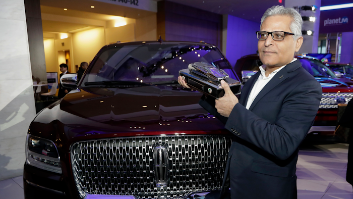 Kumar Galhotra stands next to the 2018 Lincoln Navigator after the vehicle won truck of the year during the North American International Auto Show. Galhotra has been named the replacement for Raj Nair, the president for North America, who was ousted this week over allegations of inappropriate behavior.