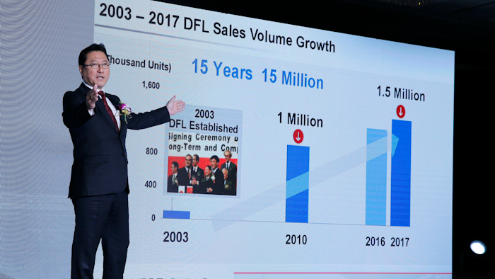Dongfeng President Jun Seki gestures while speaking during its 2018-2022 midterm plan press conference in Beijing. Nissan will start sales of its all-electric Leaf in China this year and develop 20 electric models with its Chinese partner over the next five years, the companies said Monday.