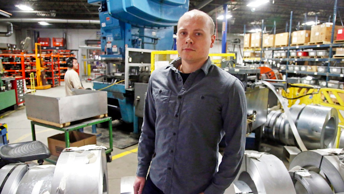 Andrew Tjernlund, a co-owner of Tjernlund Products, which manufactures fans and ventilation equipment, poses for a photo at his business Wednesday, Feb. 7, 2018, in White Bear Lake, Minn. 'The tax cut allows us to invest more in our growing business,' he says. 'In this low-unemployment environment, securing and rewarding our employees is the best use of this freed-up money.'