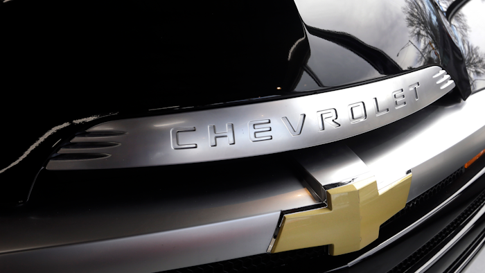 In this April 10, 2017, photo, a Chevrolet is displayed in an auto showroom in Andover, Mass. General Motors Co. reports earnings, Tuesday, Feb. 6, 2018.